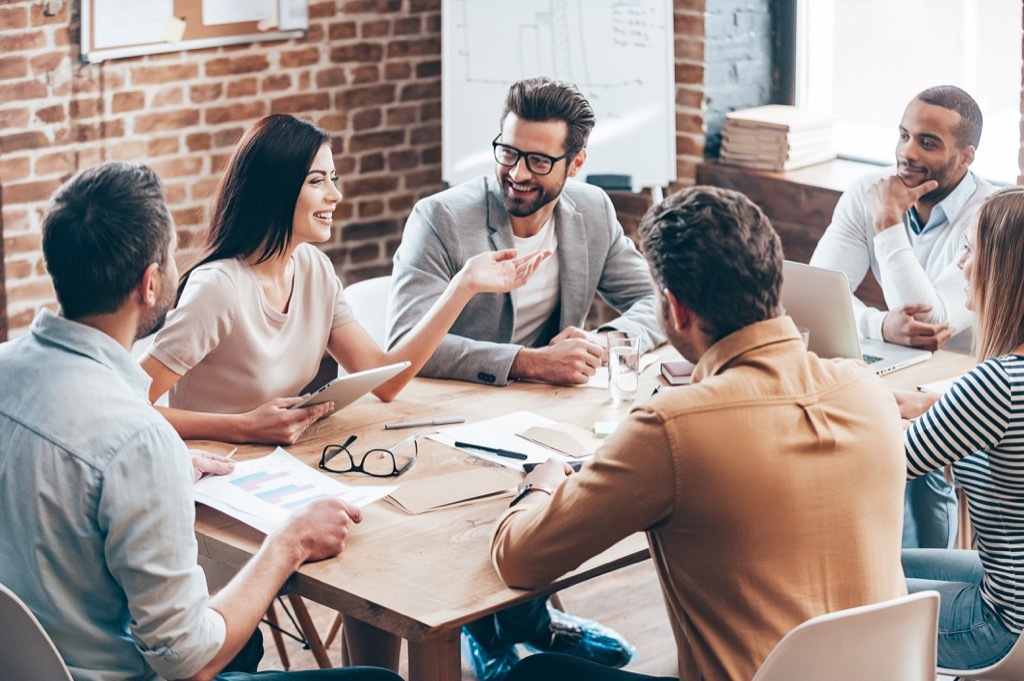 Employees in a Meeting Signs of Burnout