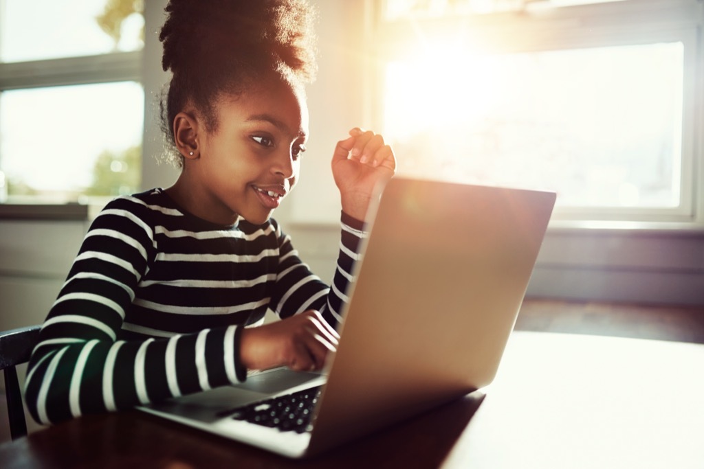 kid on computer doing homework