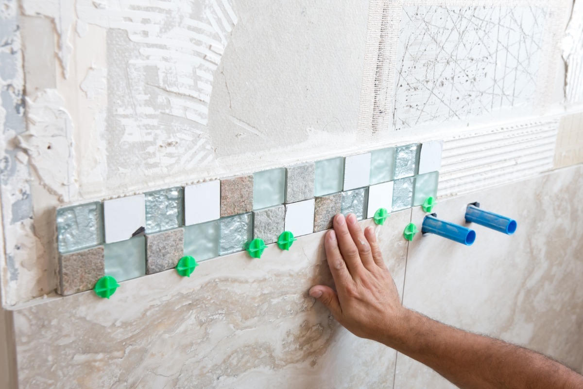 laying tile in backsplash