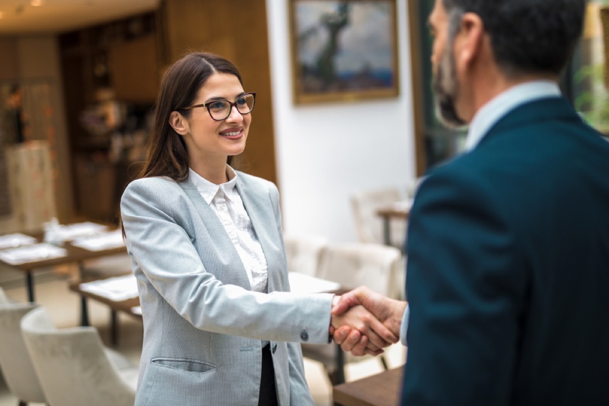 colleagues shaking hands, handshake, things husband should notice