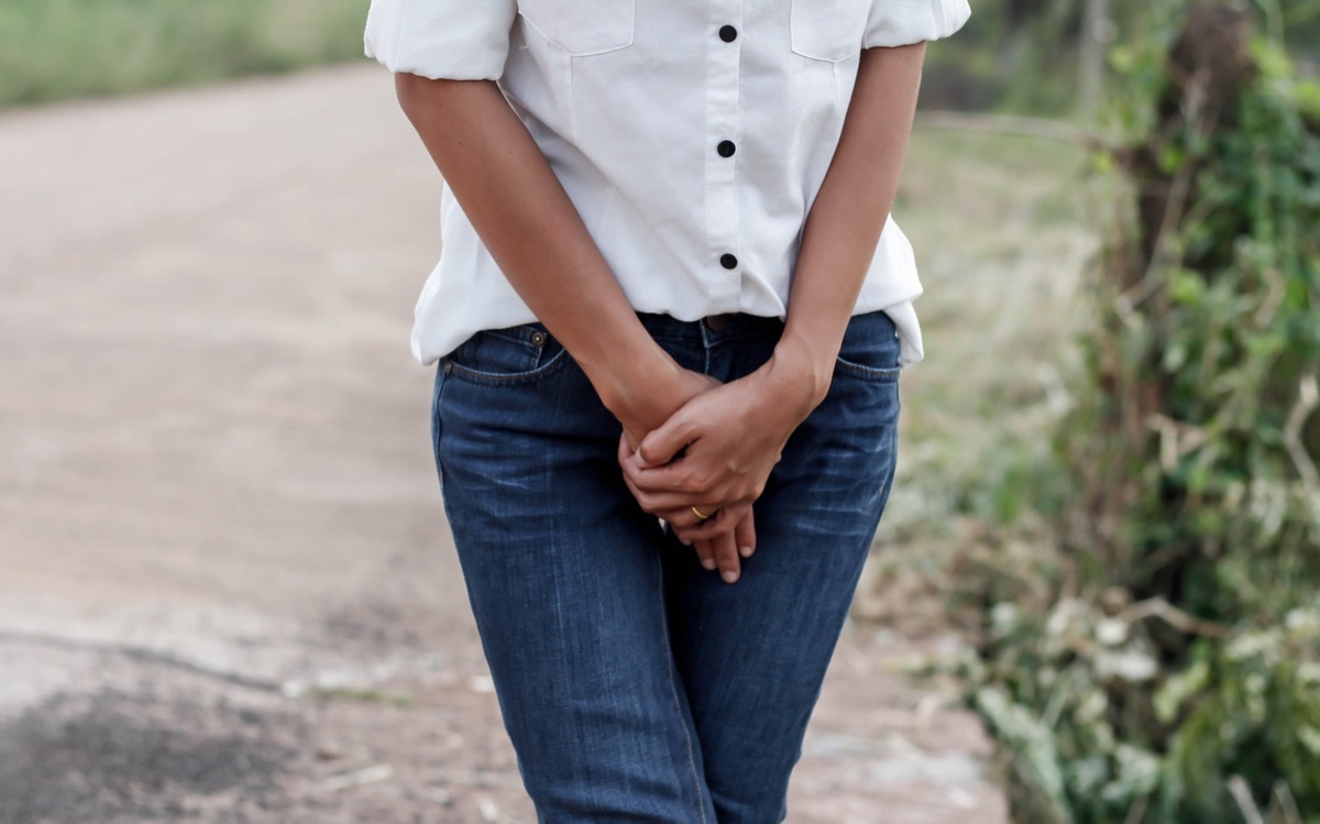 woman holding her pee