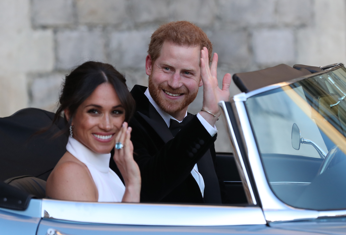 Britain's Prince Harry, Duke of Sussex, and Meghan Markle, Duchess of Sussex, leave Windsor Castle in Windsor on May 19, 2018