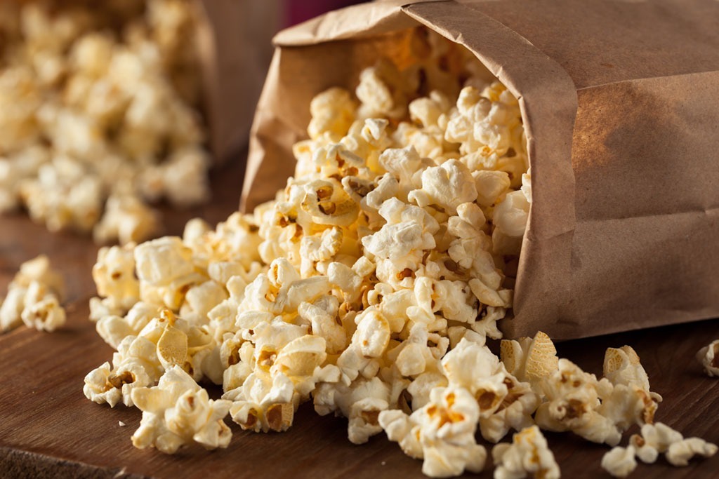 bag of popcorn spilled on table