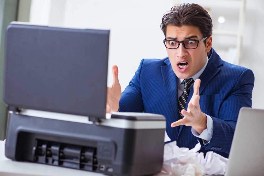 man angry at printer