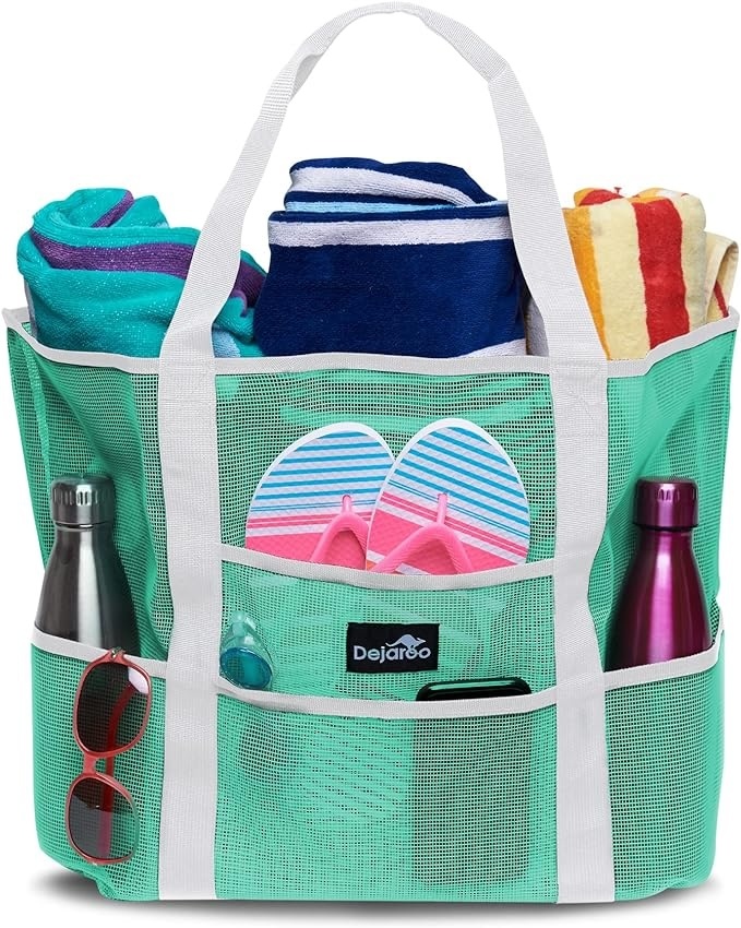 A seafoam green Dejaroo beach tote bag