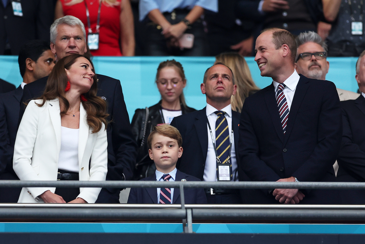 Catherine, Duchess of Cambridge, Prince George of Cambridge and Prince William, Duke of Cambridge and President of the Football Association look on during the UEFA Euro 2020 Championship Final between Italy and England at Wembley Stadium on July 11, 2021 in London, England.