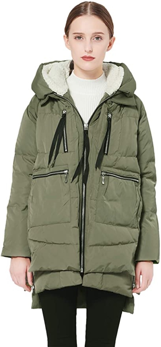 white woman in green puffer coat