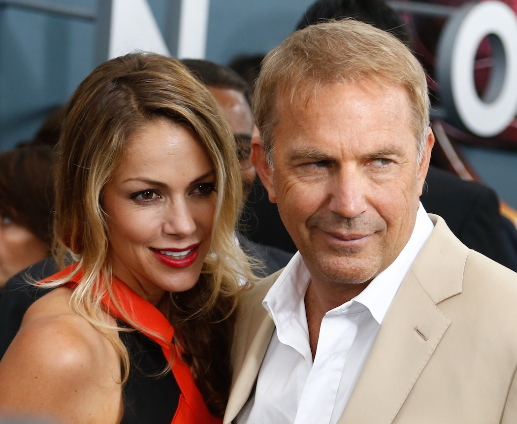 Christine Baumgartner and Kevin Costner at the premiere of 