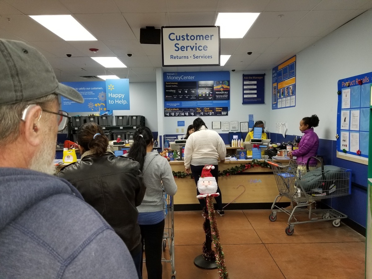 walmart customer service desk with long line