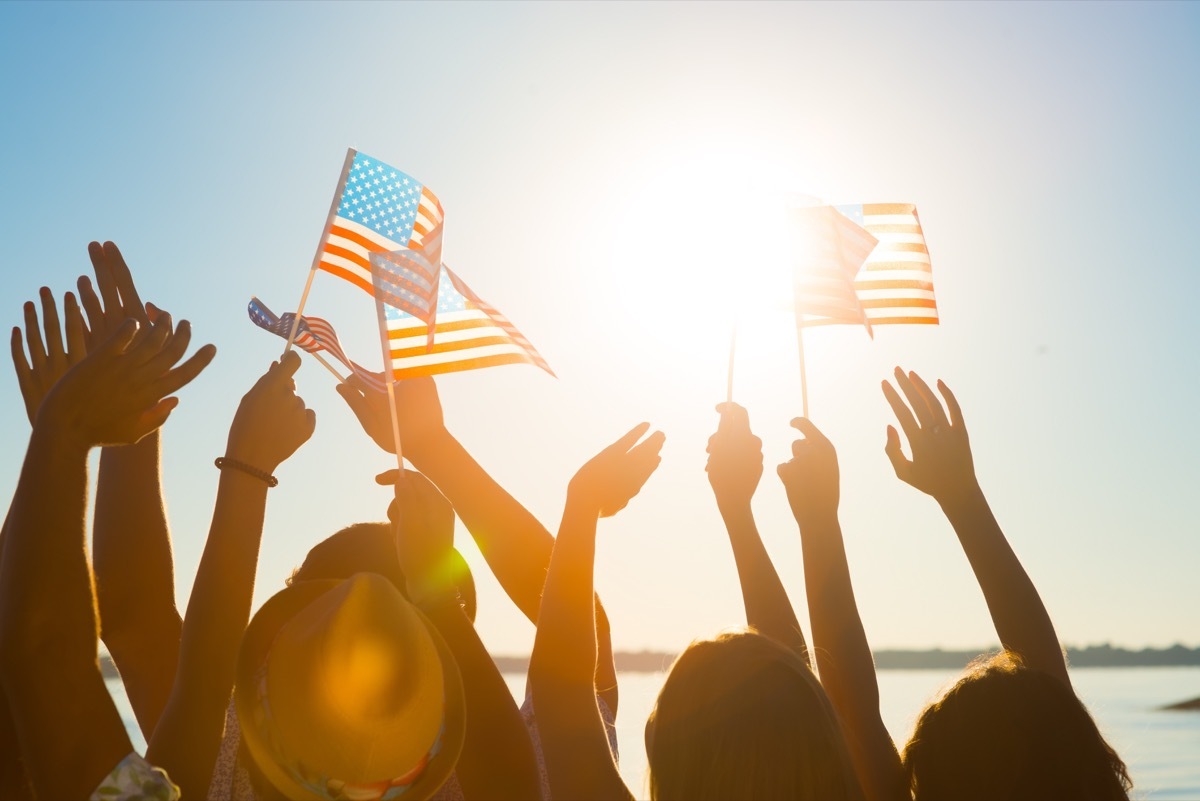 people waving american flags